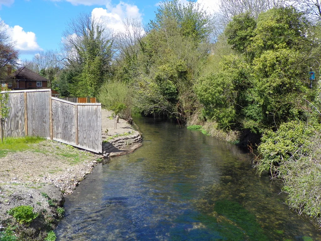 The River Wye at Wooburn Green. The chalk stream and the Glory Mill Loop run through the application site, and the width of the buffer between the water and the parked cars was the sticking point; this photograph was taken elsewhere on the same river