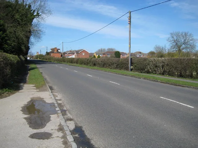 The A4129 Thame Road through Longwick, photographed in March 2008. The application site fronts this road, which the parish council says is already congested and subject to speeding