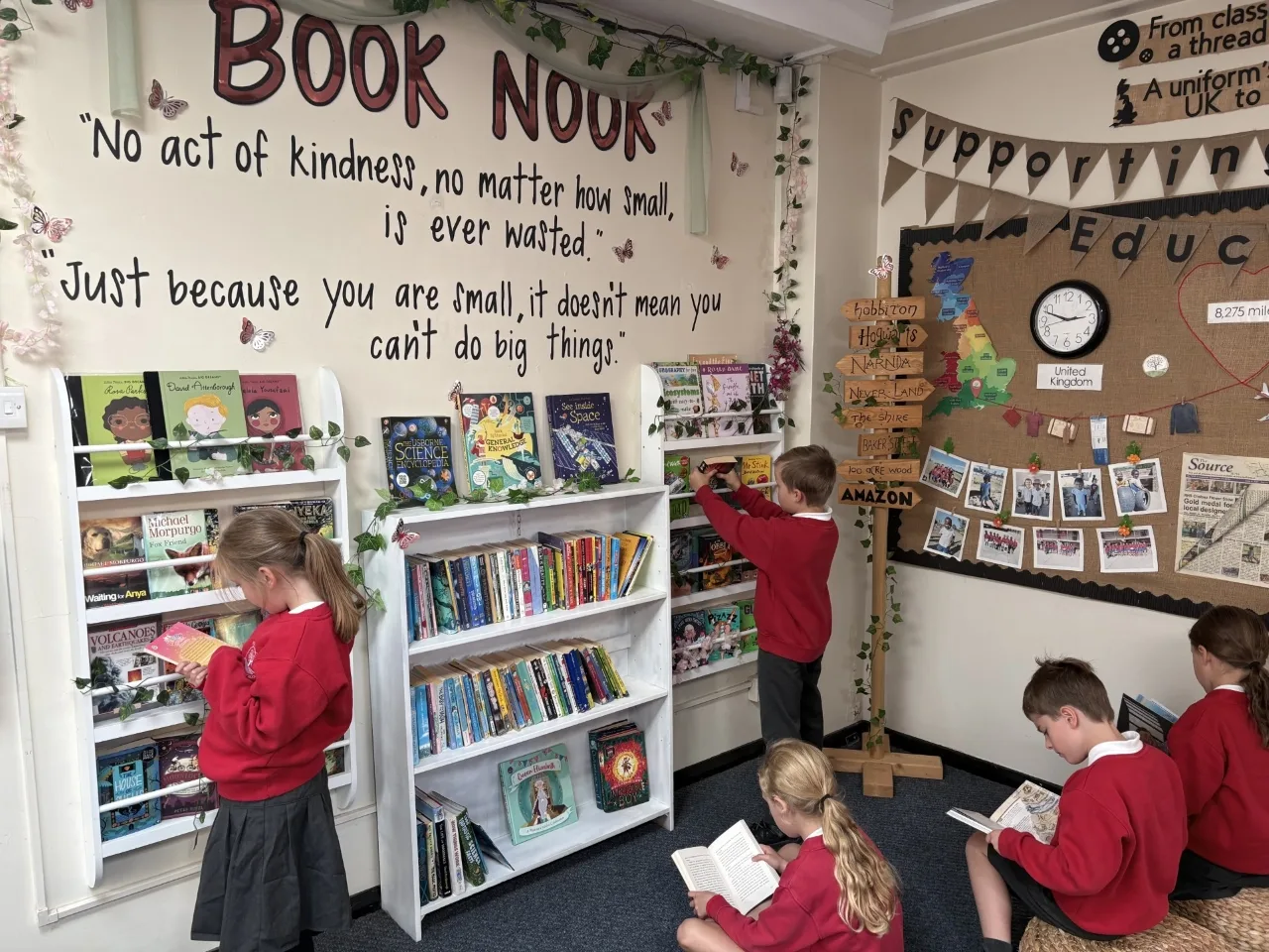 Pupils reading in the Book Nook at Prestwood Junior School