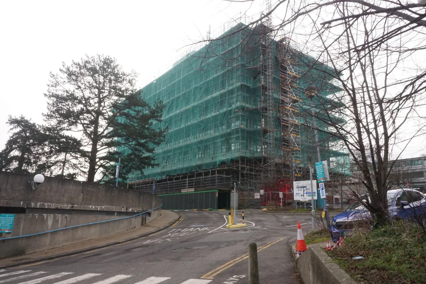 The tower block at Wycombe Hospital under scaffolding in January 2024. The trust wants to move its core services out of it and into the new six-storey building going up on the main car park